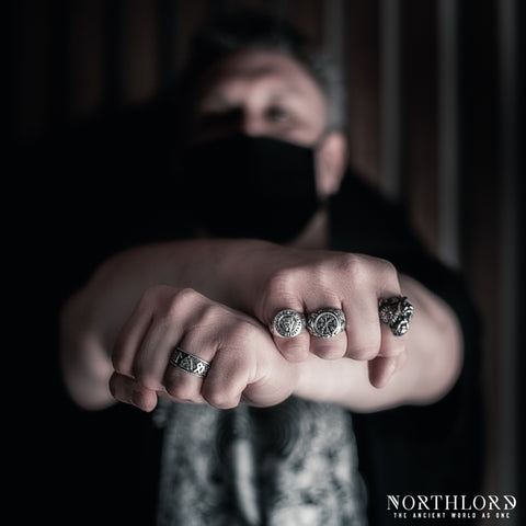 Male Model wearing silver rings and posing with crossed hands - Northlord