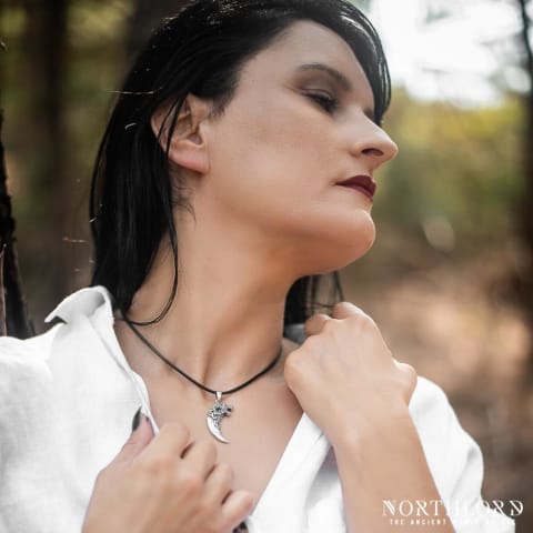 A female model wearing a wolf fang pendant in sterling silver - Northlord (2)