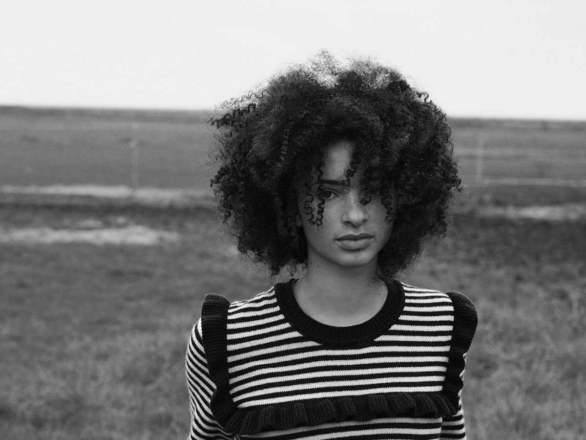 woman with curly hair black and white