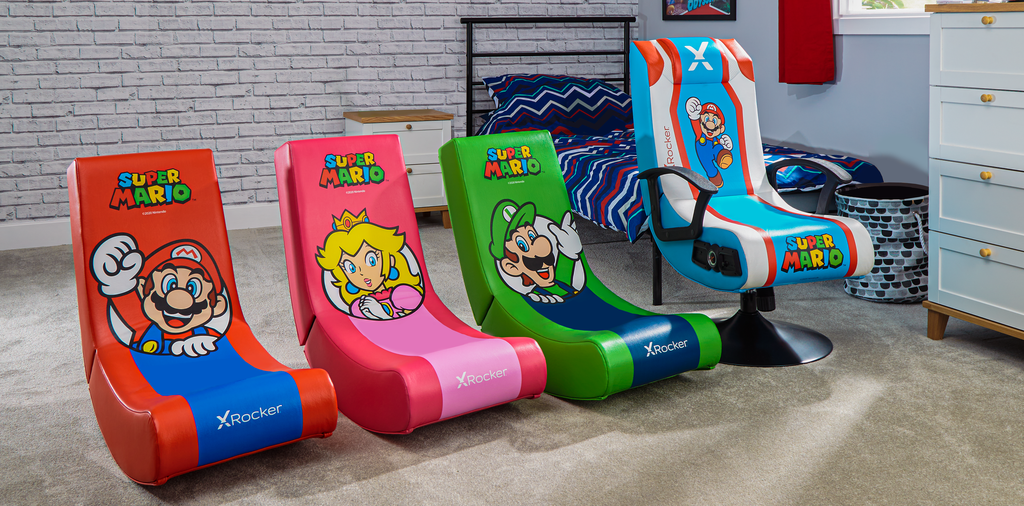 Mario, Princess Peach, Luigi Nintendo characters are featured on gaming chair floor rockers and pedestal gamer chair.  From left to right: red mario floor rocker, pink princess peach floor rocker, green luigi floor rocker, and blue mario pedestal with audio