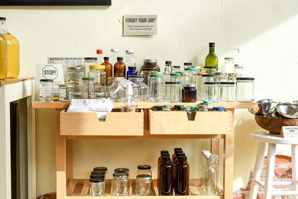 A table with clean, reused jars, ready to be used at the refill station.