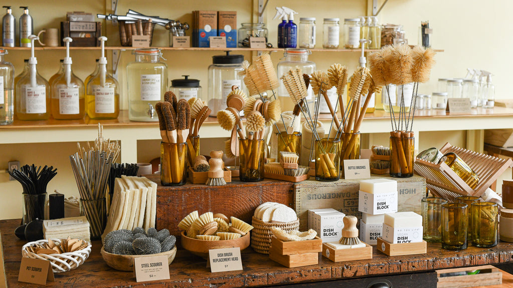Refill and zero waste shop, Ware, in Asheville, NC displays wooden dish brushes and other sustainable products.