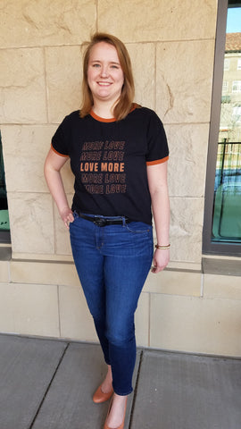 Christine wearing "Love More" shirt