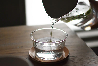 Pouring water into CAST bowl with CAST coaster 