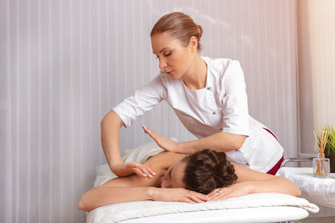 Spa specialist giving a massage service