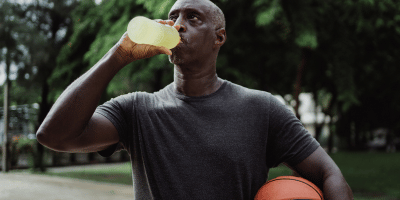 Man drinking electrolytes after basketball