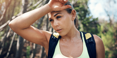 Woman sweating on a hike