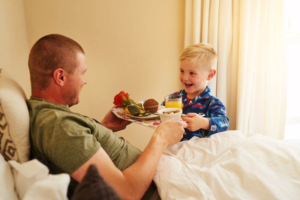 Have breakfast in bed as Fun Ways to Celebrate Father's Day