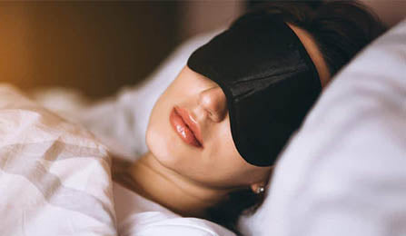 Women sleeping with a sleeping mask