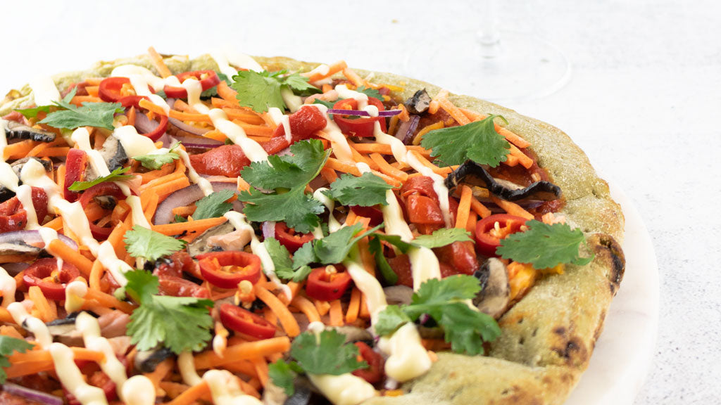 Carrot pizza on basil base