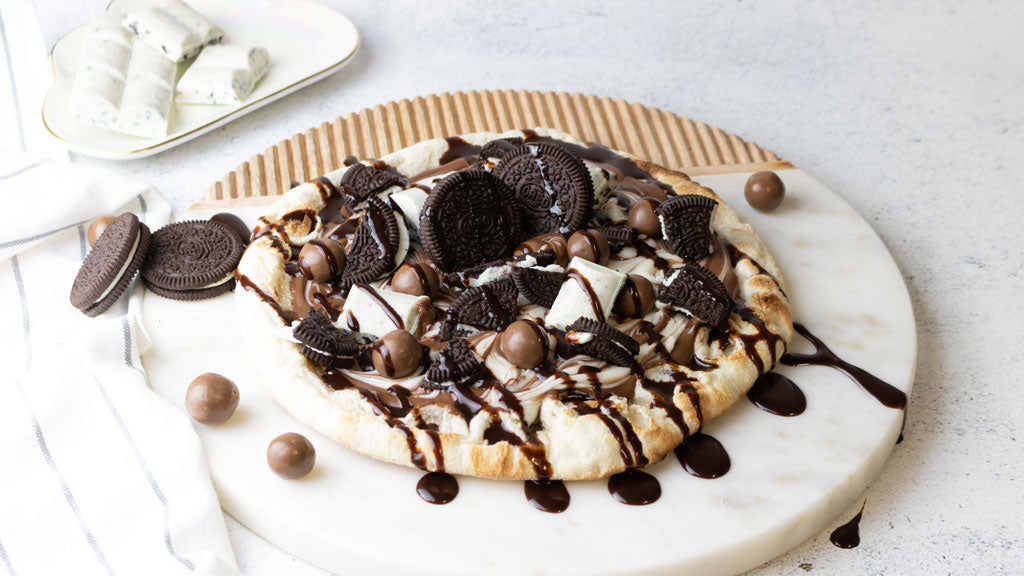 Cookie dessert pizza on marble board