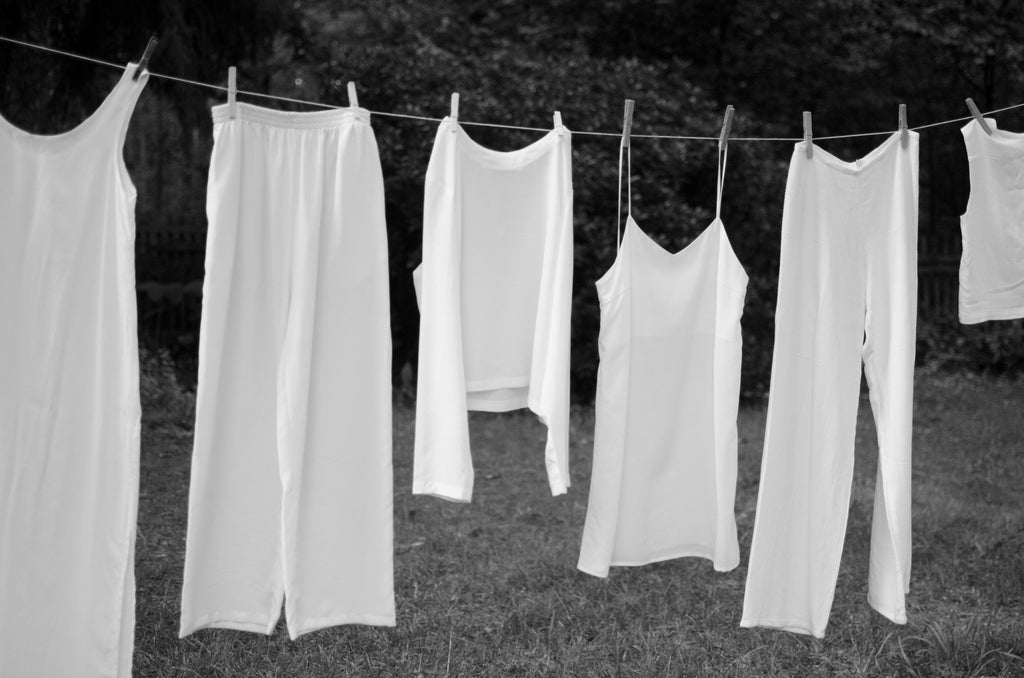 white clothes hanging to dry