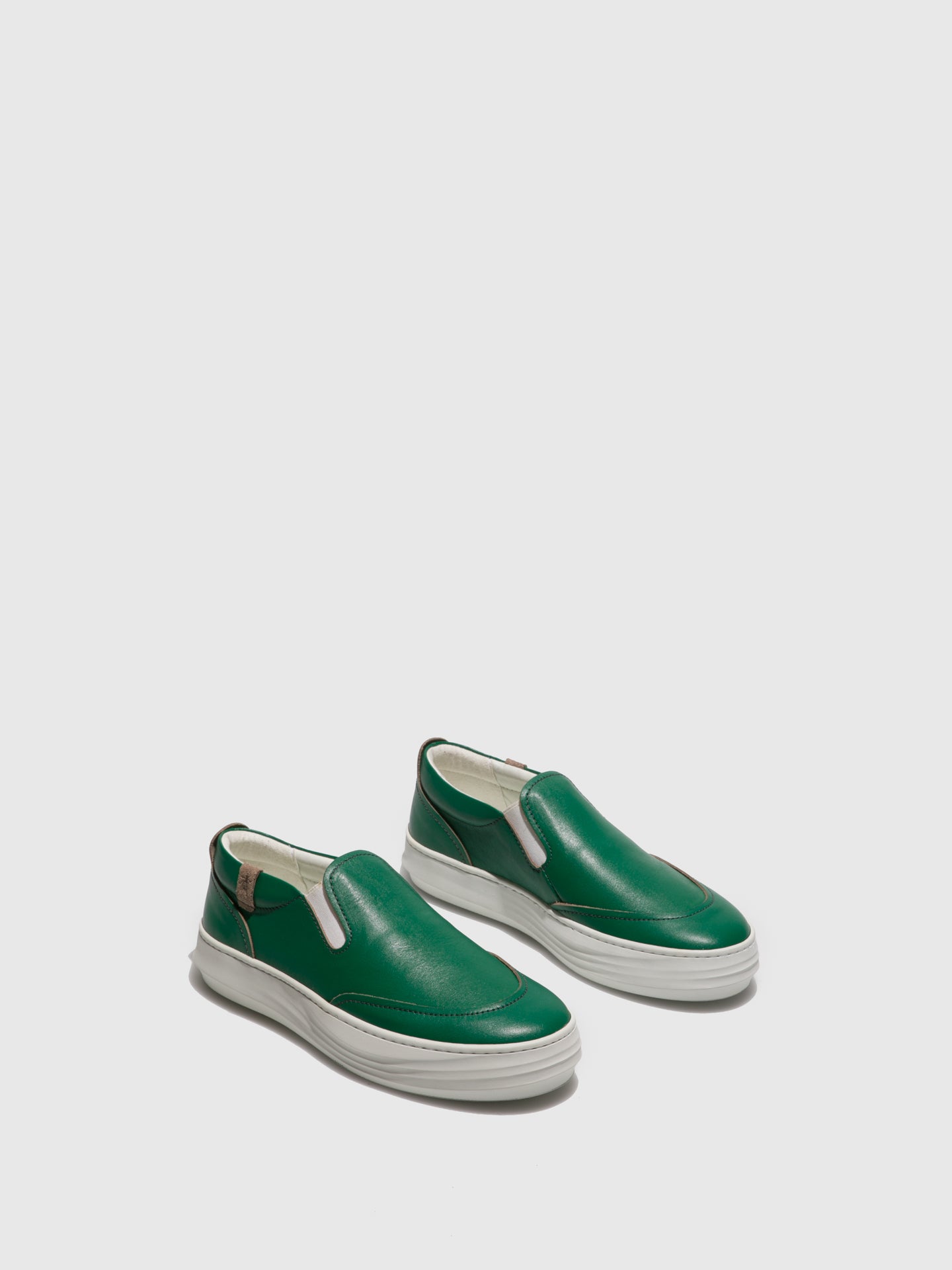 green slip on trainers