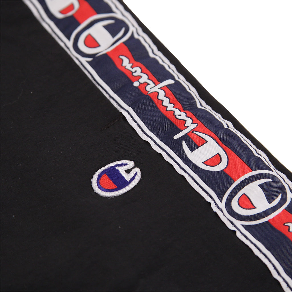 champion black and red taping track pants