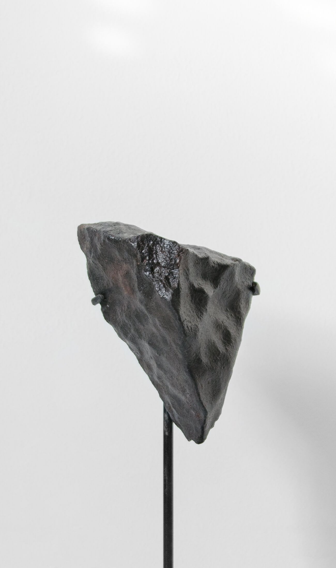 Meteorite on bronze stand