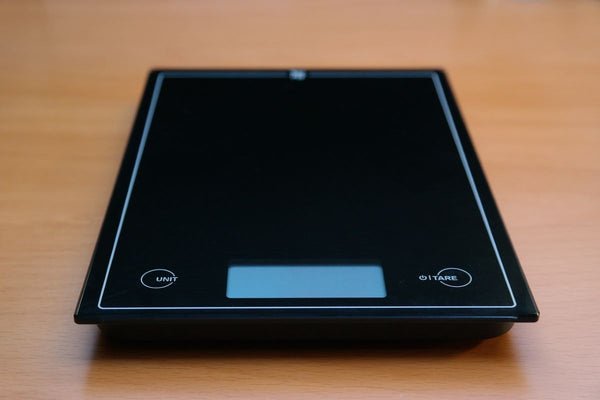 Close-up of a high-precision analytical balance in use