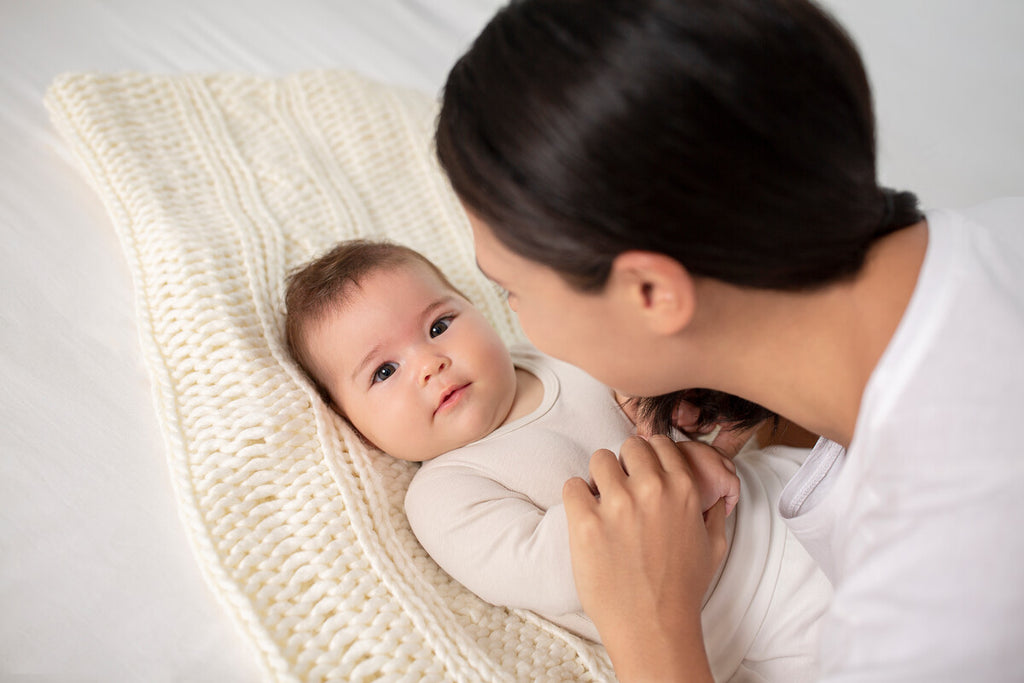 happy baby with mother