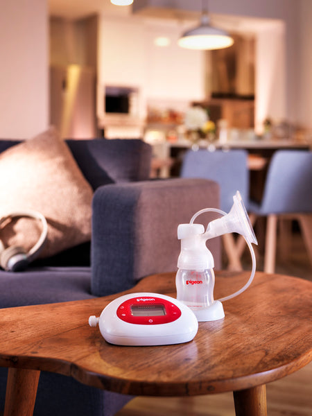 electric breast pump on loungeroom table