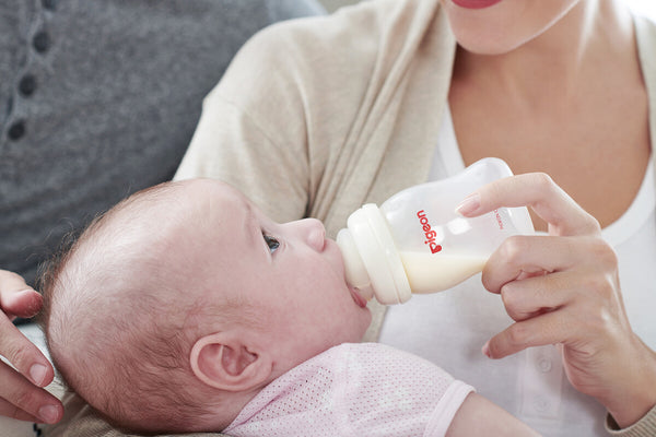 baby drinking from softouch baby bottle