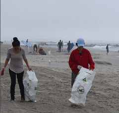 raw elements team cleaning up rockway beach from plastic