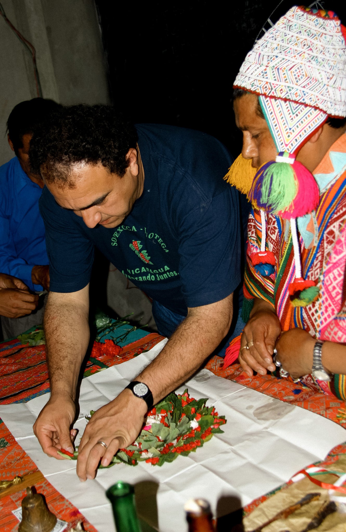 Raul de Aguila from Cocla prepares offering for Dia de Pachamama with Peru Shaman