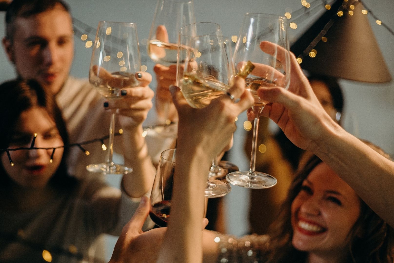 Friends raising glasses at a party