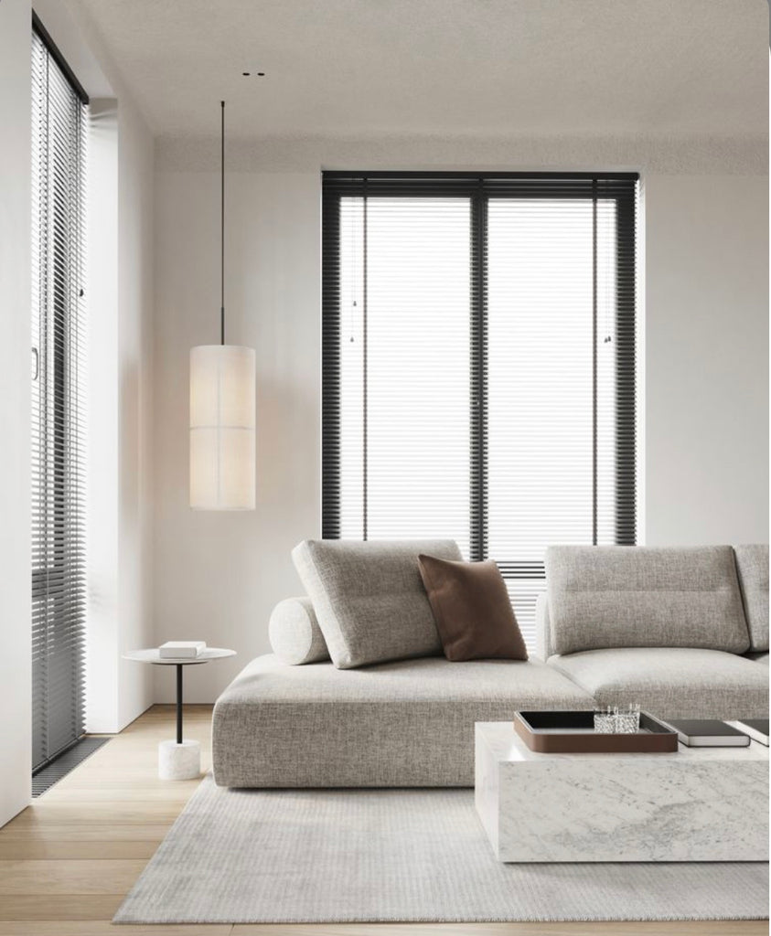 marble coffee table next to the grey fabric sofa