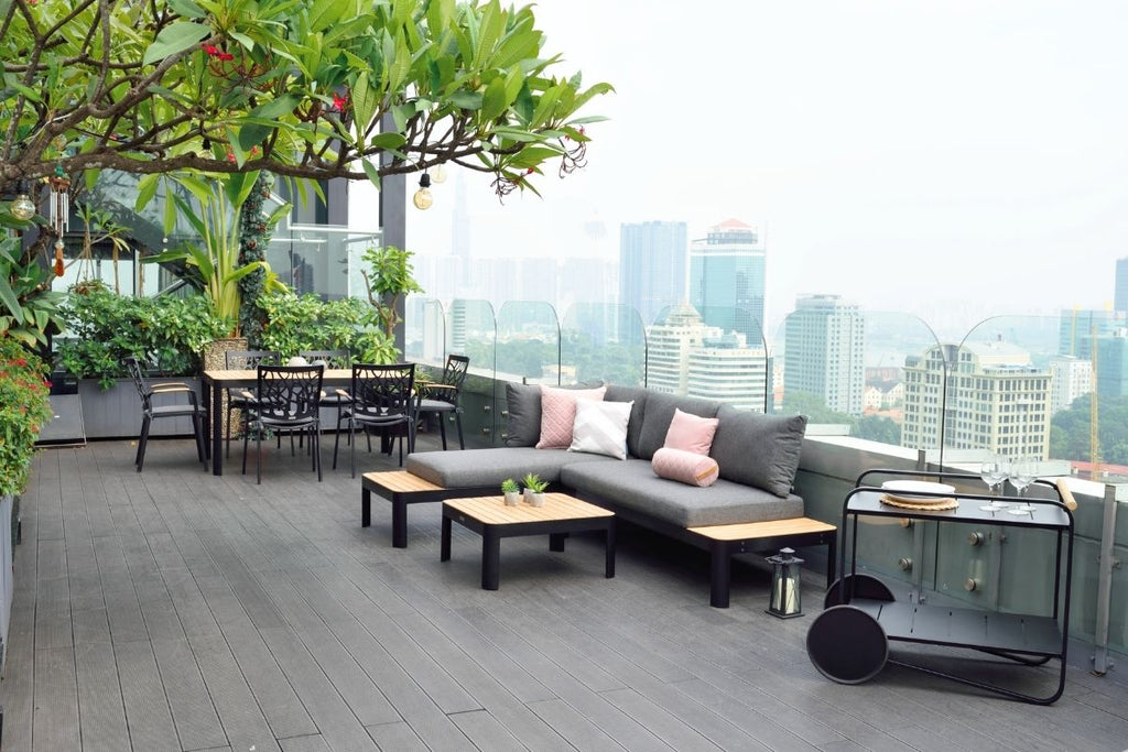 black tea trolly on roof top with city view