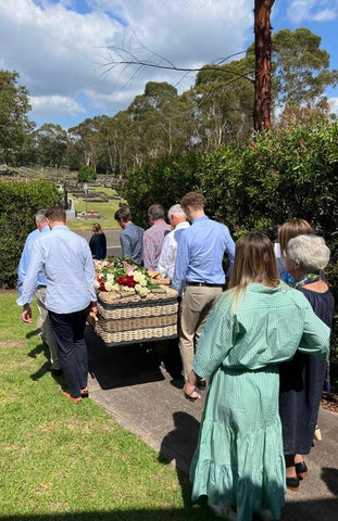 Family and friends carrying the coffin with Northern Beaches Funerals