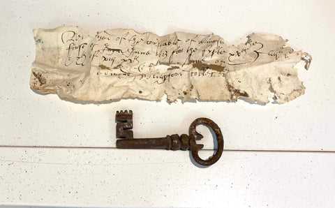 A medieval key and tax receipt from 1603 found hidden in a beam in Apsley Cottage by Sarah and Matthew Day. 