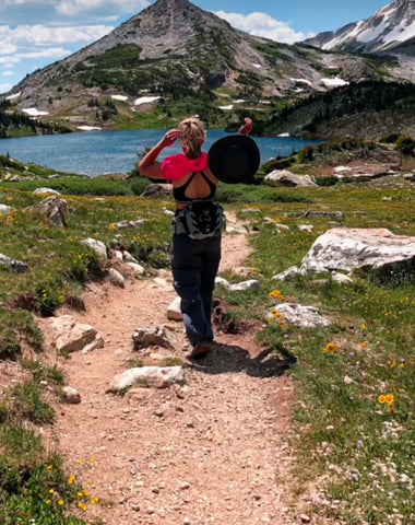 Kera looking out at a mountain lake