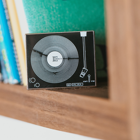 Enamel turntable pin by Deep Cut showing a vintage turntable design