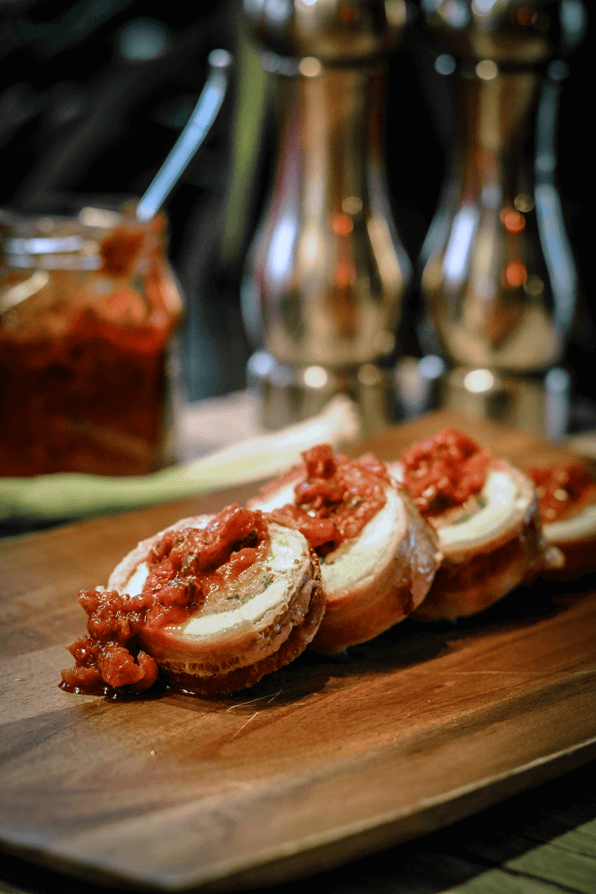 chicken ballotine with bacon and tomato pesto sauce