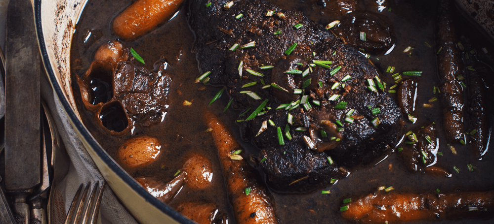 beef stew in a pot with potatoes and carrots