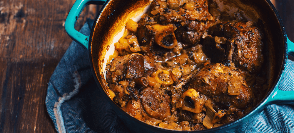 pork osso buco with vegetables and couscous