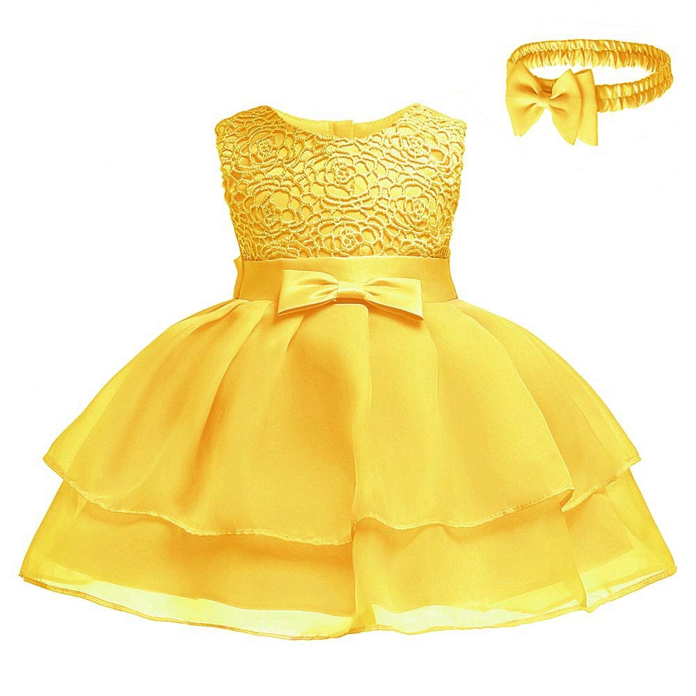 baby girl in yellow dress