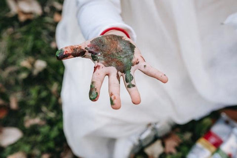 messy kids hands from play