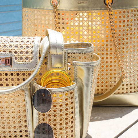 Gold All Weather Bangles in Marche tote next to Cite tote