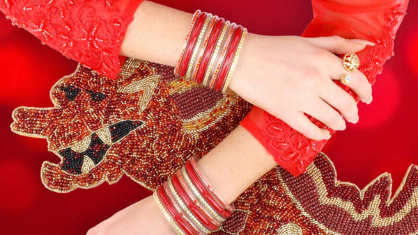 Red and Gold Year of the Dragon Bangle Bracelet Stack on Model Wearing Red Dress for Lunar New Year | BuDhaGirl