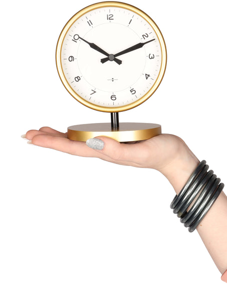 Model wearing Graphite All Weather Bangles while holding a table clock | BuDhaBrief by BuDhaGirl