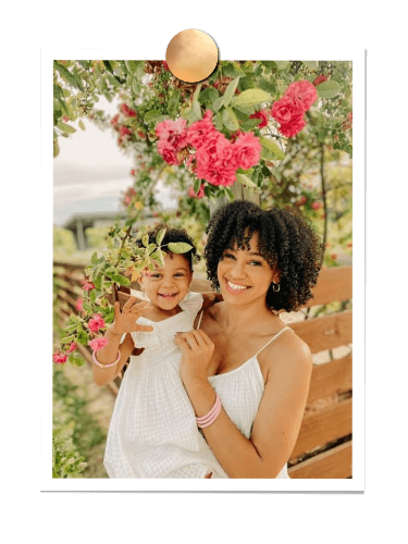 Ashley Williams and her baby daughter smiling | BuDhaGirl