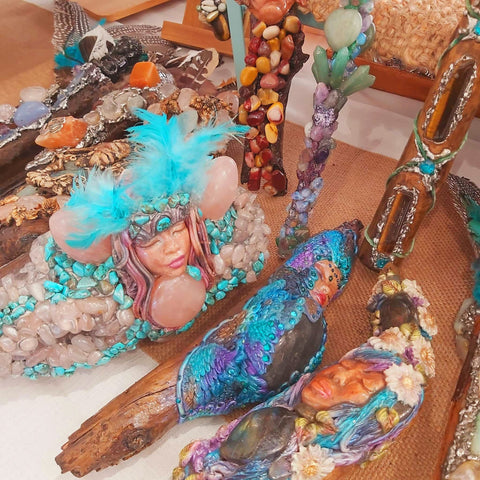 An image of crystal wands made of gemstones and clay