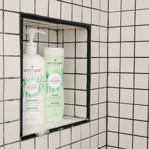 Nourishing shampoo for cold weather inside a shower with white tiles