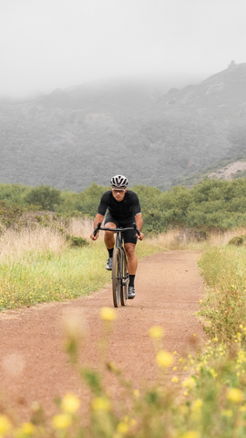 image of man riding gravel bike