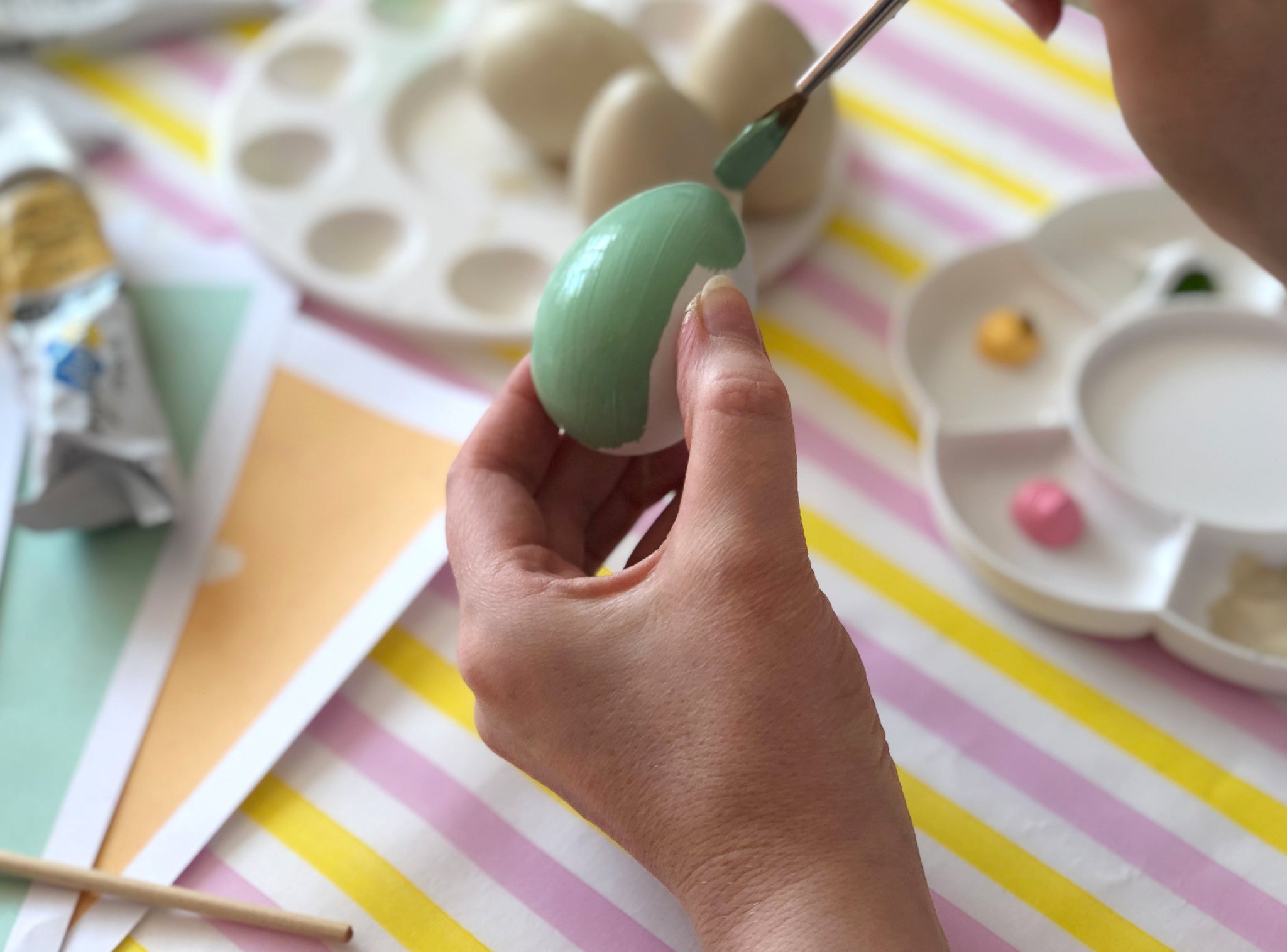 Green painted Easter egg craft for kids