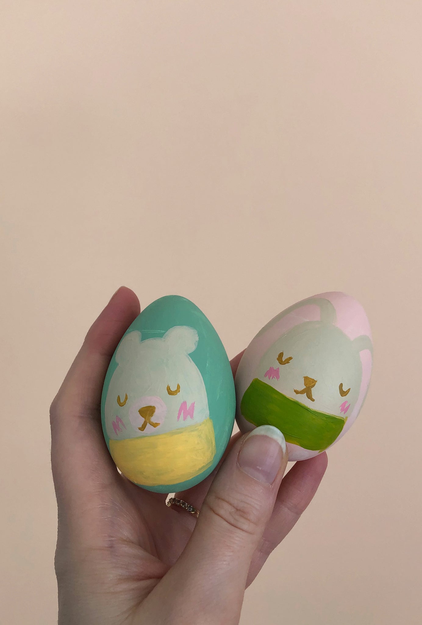 Two bunny painted on Easter Egg crafts for kids