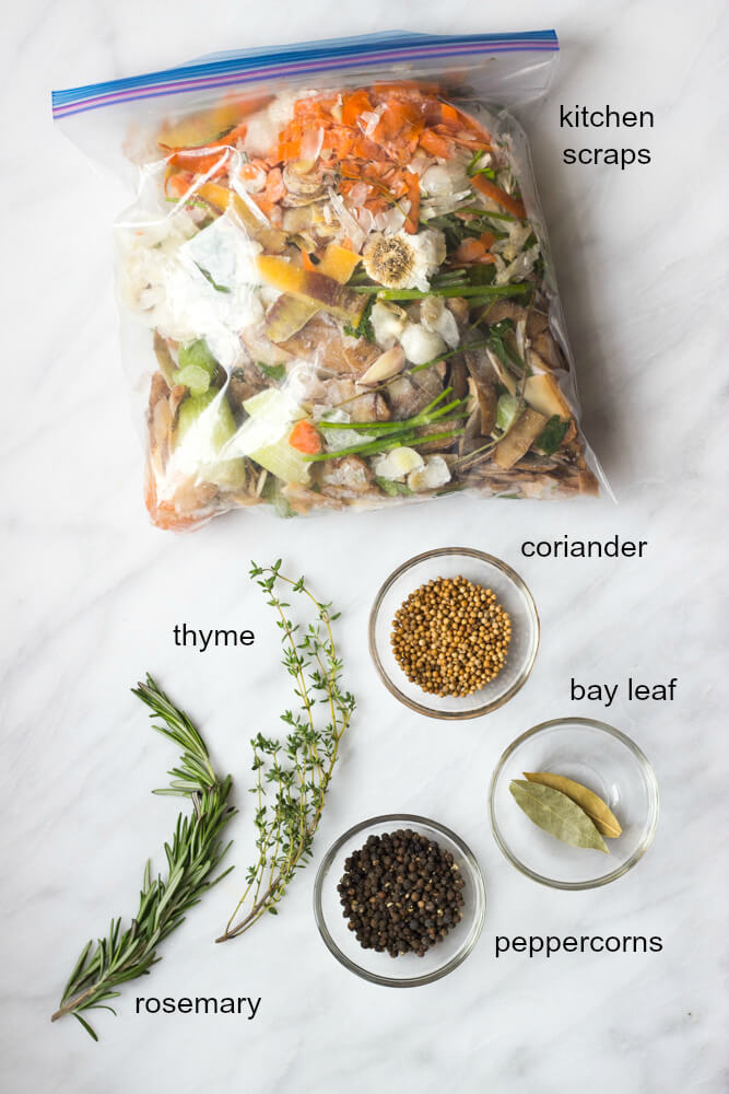 vegetable scraps inside storage bag and examples of herbs