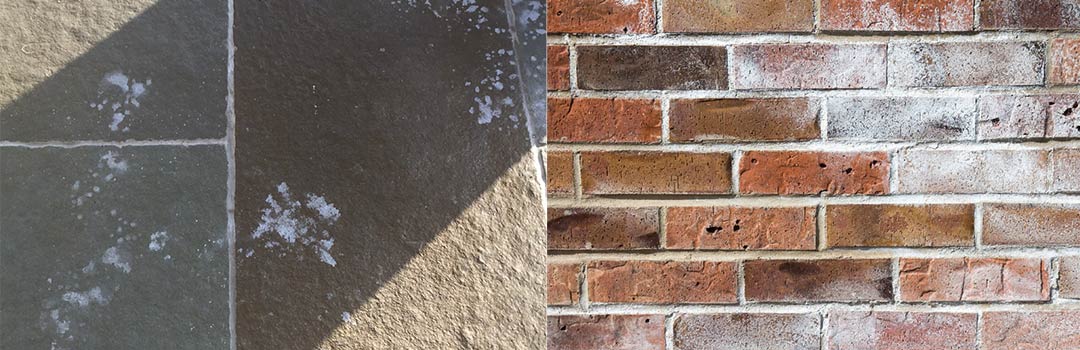 Efflorescence on natural stone and on a brick wall