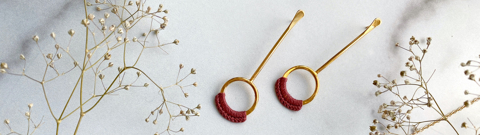 Droplet Earrings on a white background with flowers