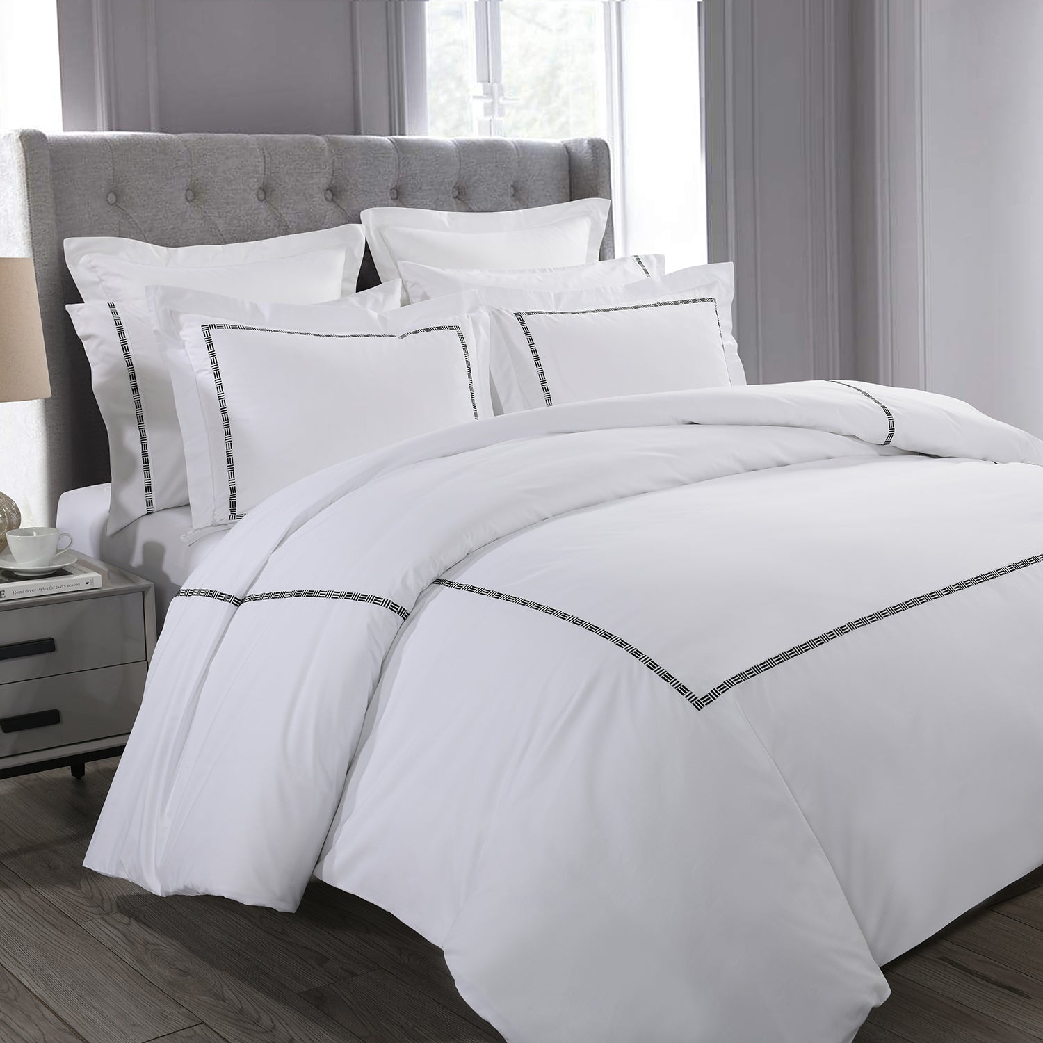 White comforter and pillow shams on a bed | Riverbend Home